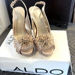 Aldo’s beige satin sling back platform high heal dress shoe